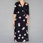 BLACK AND PEACH POLKA DOT WRAP TIE DRESS