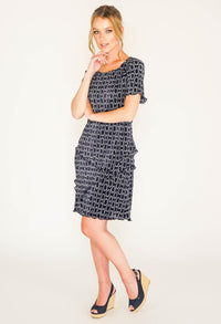 NAVY PRINT CIRCLE DRESS WITH ASYMMETRICAL PANELS