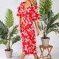 wrap dress in red with a leaf print design