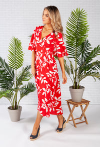 wrap dress in red with a leaf print design