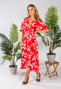 wrap dress in red with a leaf print design