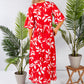 wrap dress in red with a leaf print design