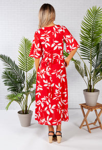 wrap dress in red with a leaf print design