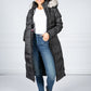 Long Quilted Down Feather Coat with Faux Fur Hood in Black